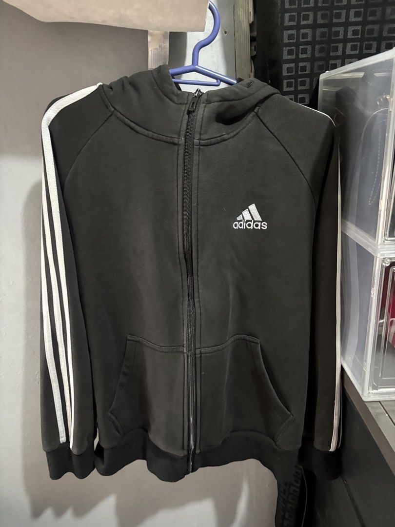 Adidas Black Zip-Up Hoodie Jacket (Category: Coats, Jackets and Outerwear) located in Marikina City. Submitted by lily.ca (Listing ID 1439600323, Image 3). Description: - Adidas black zip-up hoodie jacket - White stripes on sleeves - Front zipper closure - Two front pockets - Adidas logo on chest - Size: L - Features Climalite technology - Classic design - Ideal for casual wear Hindi na naalis zipper nya.