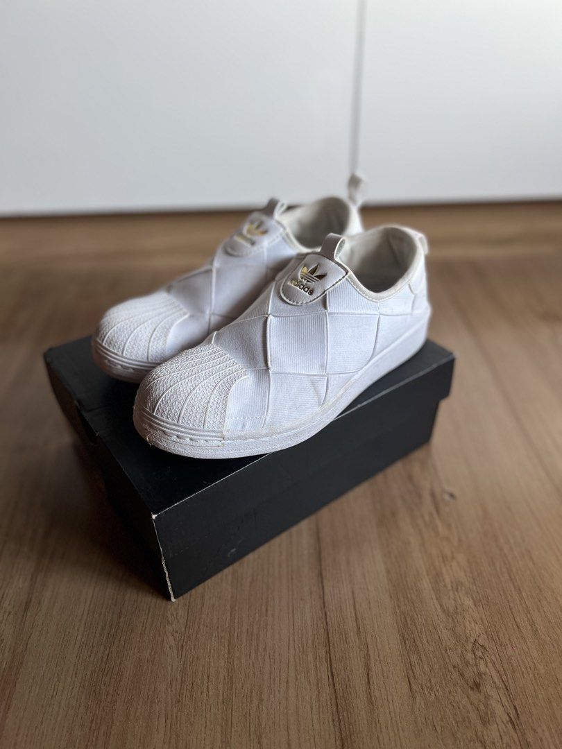 Adidas Superstar Slip-On White Womens (Category: Sneakers) located in Pasig City. Submitted by grndhub (Listing ID 1439528098, Image 3). Description: - Original Adidas Superstar slip-on womens - White - Classic shell toe - Woven upper - Size: US 6, UK 4.5, EUR 37 1/3 - No box - Just needs cleaning Pick up Pasig.