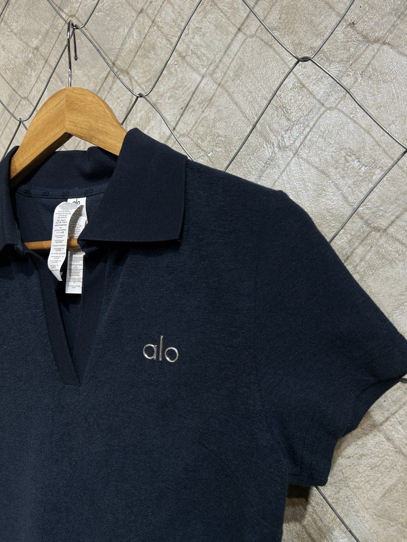 Alo Navy Polo Shirt (Category: Activewear) located in Manila. Submitted by ardobe.mnl (Listing ID 1439462852, Image 3). Description: Alo Collared Top. Size: Medium Dimes: 17.5x22.5 Condition: Good asnew Flaw: None! Mine: m Dm to purchase! 📥.