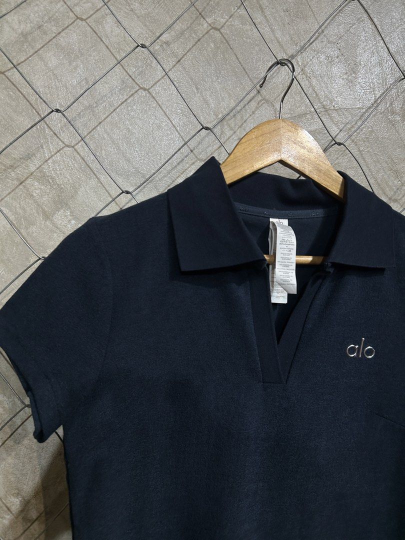 Alo Navy Polo Shirt (Category: Activewear) located in Manila. Submitted by ardobe.mnl (Listing ID 1439462852, Image 2). Description: Alo Collared Top. Size: Medium Dimes: 17.5x22.5 Condition: Good asnew Flaw: None! Mine: m Dm to purchase! 📥.
