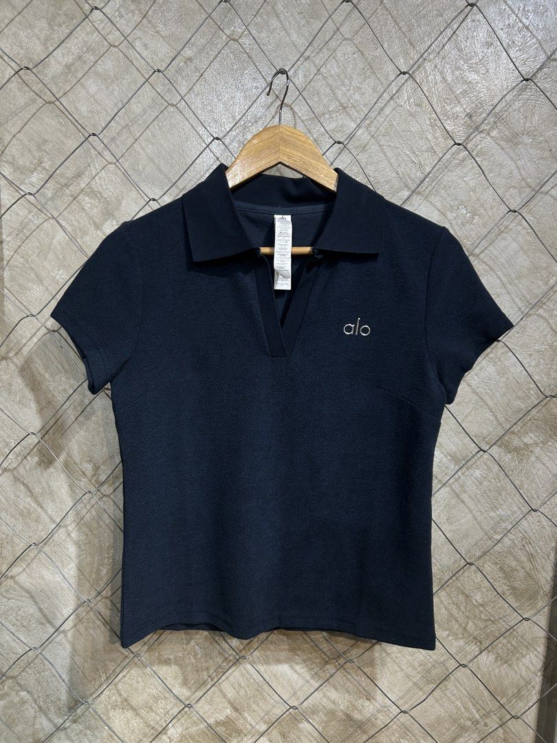 Alo Navy Polo Shirt (Category: Activewear) located in Manila. Submitted by ardobe.mnl (Listing ID 1439462852, Image 1). Description: Alo Collared Top. Size: Medium Dimes: 17.5x22.5 Condition: Good asnew Flaw: None! Mine: m Dm to purchase! 📥.