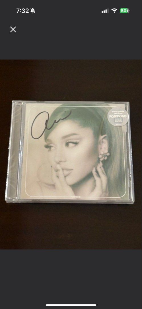 Ariana Grande Positions Signed CD (Category: CDs & DVDs) located in Manila. Submitted by stefandraboutique (Listing ID 1439539208, Image 1). Description: - Sealed 'Positions' CD by Ariana Grande - Features a signature - Still in original packaging - Made in Mexico - Includes popular tracks: '34+35', 'pov', and more - Tracklist visible on the back.