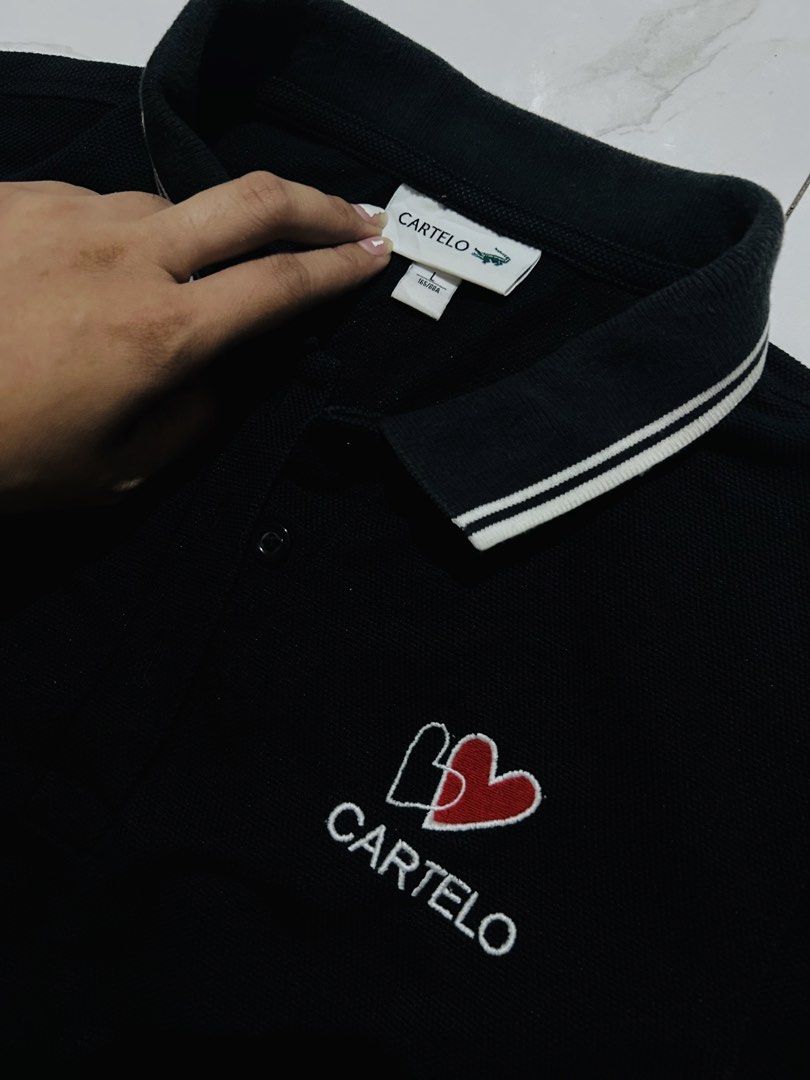 Auth cartelo polo dress (Category: Dresses) located in Bauang. Submitted by alyssaaaamm (Listing ID 1439597696, Image 2). Description: black Cartelo polo shirt dress with a white-striped collar and sleeve cuffs.small-medium.