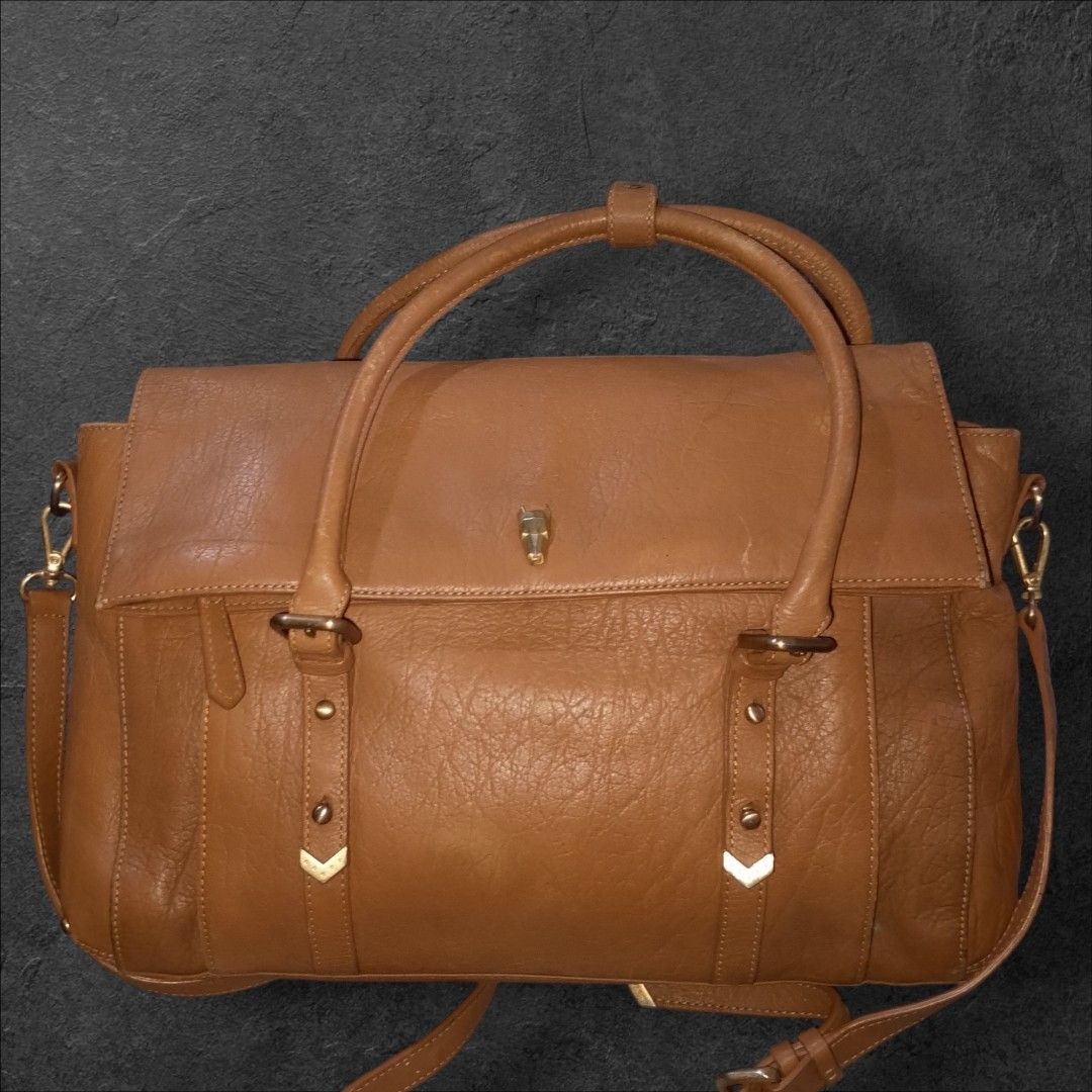 Auth Most by Lapalette Genuine Leather Bag (Category: Shoulder Bags) located in Cebu City. Submitted by jc_online_shop (Listing ID 1439601191, Image 1). Description: 12" x 10" x 4" tan brown genuine leather material adjustable strap.