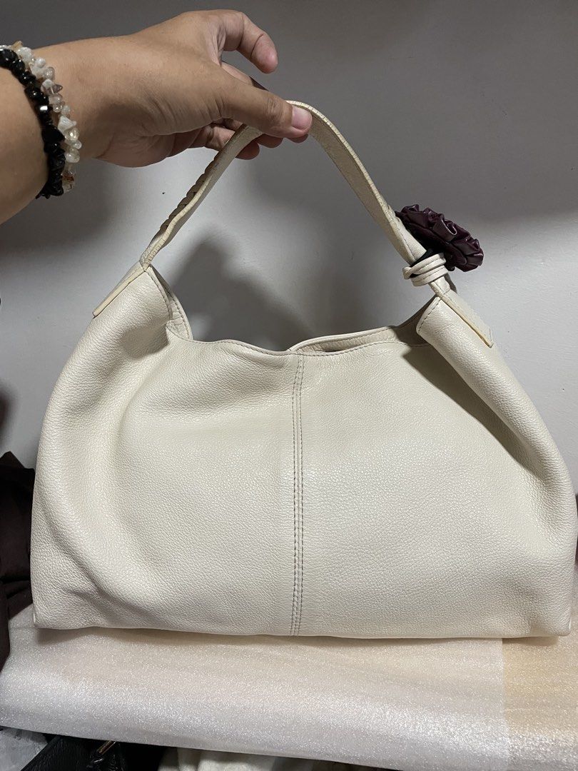 Authentic Furla White Elisabeth Leather Hobo Bag (Category: Luxury Bags & Wallets) located in Guiguinto. Submitted by prelovedinc2024 (Listing ID 1439510941, Image 2). Description: guaranteed authentic, bought in Japan with signs of use - fine cracks on rubber seal, some rubs, some stains/color transfer and stains inside, hairlines on the plate size: approx 16x10” .