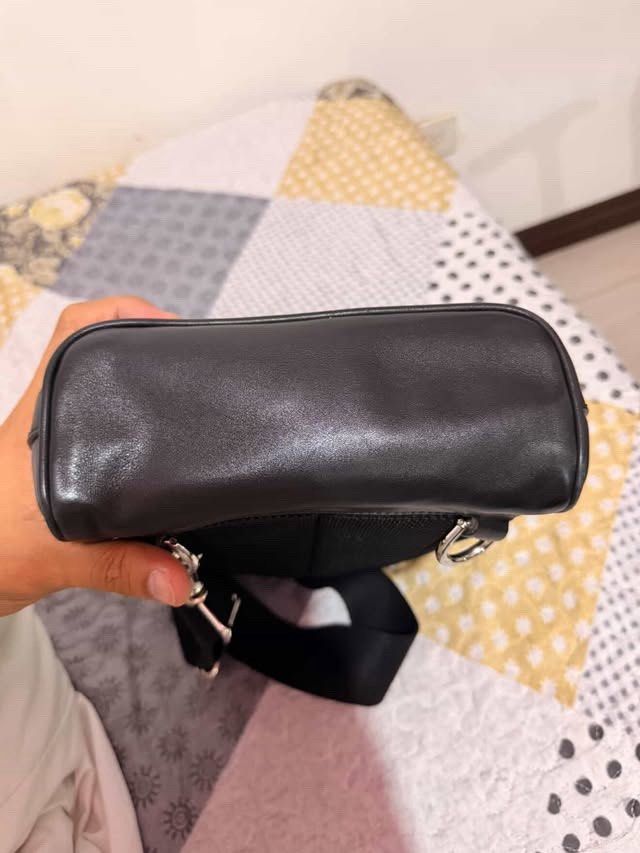 Authentic Gucci Black Guccissima all-leather mini crossbody backpack (Category: Luxury Bags & Wallets) located in Quezon City. Submitted by jiggermeister007 (Listing ID 1439598756, Image 2). Description: Authentic Gucci black Guccissima mini crossbody sling backpack with LegitGrails certificate..