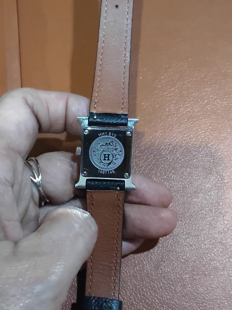Authentic Hermes H Watch (Category: Luxury Watches) located in Manila. Submitted by hardtofindcollection (Listing ID 1439566832, Image 2). Description: - Authentic Hermes H watch - Silver dial - Black leather strap - Stainless steel case - Hermes logo on buckle and case back - Swiss made.