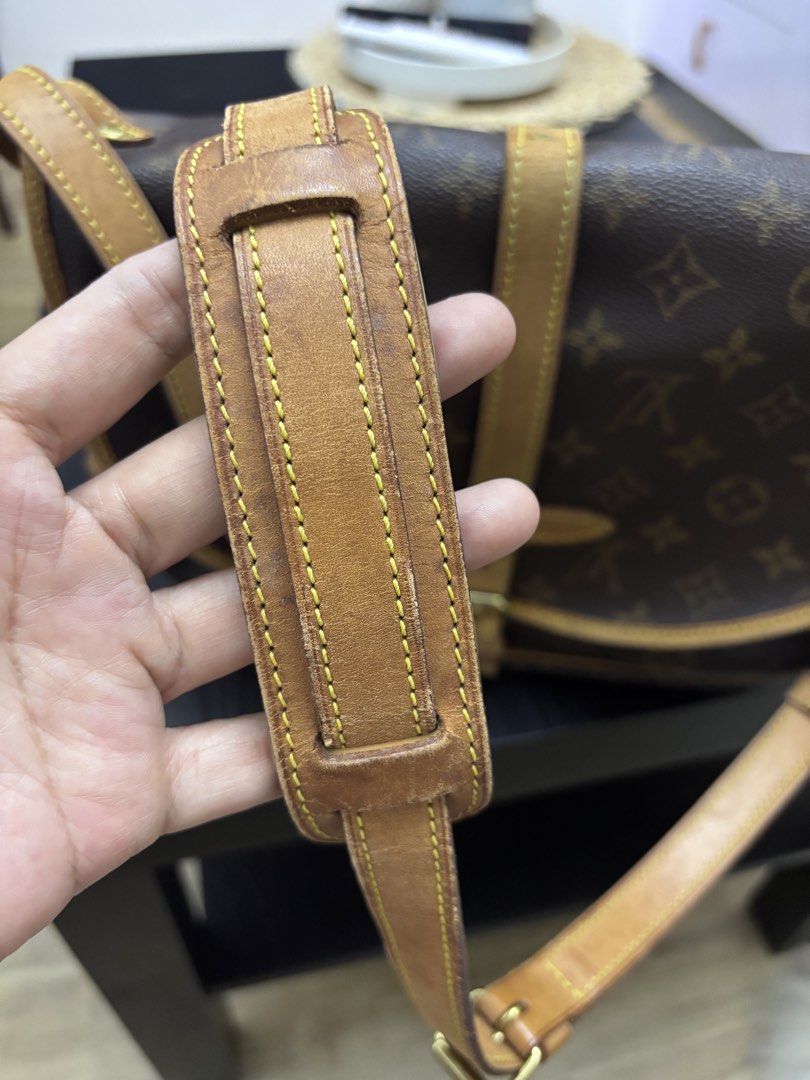 Authentic LV Saumur MB1020 Preloved (Category: Luxury Bags & Wallets) located in Quezon City. Submitted by lovedbymaxandmikoy (Listing ID 1439422046, Image 3). Description: Authentic Louis Vuitton shoulder bag in classic Monogram canvas. Features a flap closure with a buckle detail and adjustable shoulder strap. The bag has a brown leather trim and a fabric interior. Made in France..