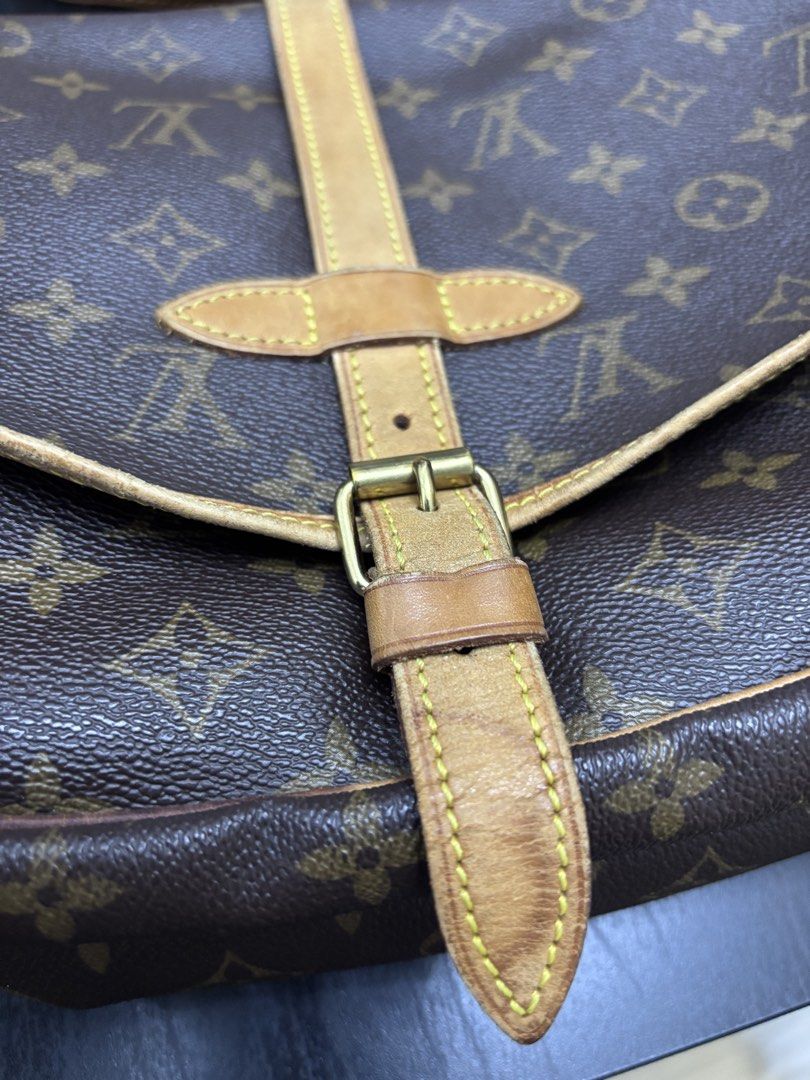 Authentic LV Saumur MB1020 Preloved (Category: Luxury Bags & Wallets) located in Quezon City. Submitted by lovedbymaxandmikoy (Listing ID 1439422046, Image 2). Description: Authentic Louis Vuitton shoulder bag in classic Monogram canvas. Features a flap closure with a buckle detail and adjustable shoulder strap. The bag has a brown leather trim and a fabric interior. Made in France..