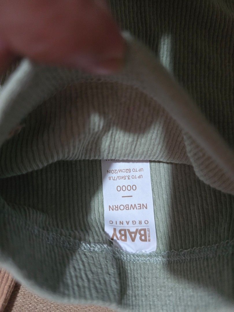 Cotton On Organic Newborn Pants (Category: Babies & Kids Fashion) located in Las Pinas. Submitted by luxeprelovedstuff (Listing ID 1439445525, Image 3). Description: - Cotton On Organic baby pants - Colors: Beige and Light Green - Size: Newborn - Features a ribbed texture.