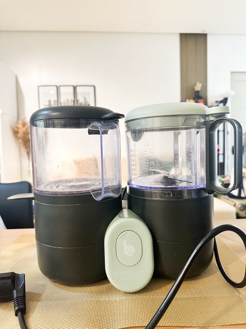 Babymoov Nutribaby One (Category: Weaning & Toddler Feeding) located in Pasig City. Submitted by apcal (Listing ID 1439436283, Image 1). Description: Original Price at +9k Selling only for ₱5,000 - Babymoov Nutribaby One: Baby food maker - Functions: Steams and blends - Features: Two compartments for cooking and blending - Accessories: Blade, steamer basket, lids - Colors: Dark grey and light green - Control Panel: Light green.
