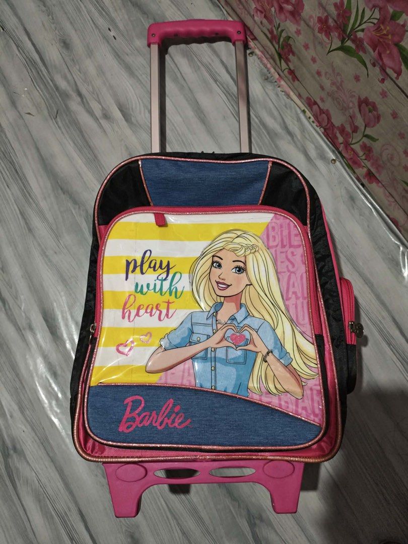 Barbie Trolley Bag - 16inches (Category: Babies & Kids Fashion) located in Manila. Submitted by leighlypicks.onlineshop (Listing ID 1439460797, Image 1). Description: Brand New / Never Used Original Barbie Trolley Bag 16-inch size Cute and stylish Barbie design Spacious compartments with side pockets Durable wheels and pull handle Perfect for school, travel, or everyday use Bought last December for ₱3,999 including lunch bag and tumbler. Selling 
