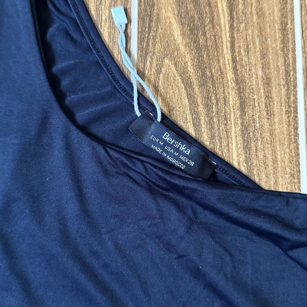 Bershka Asymmetrical Tank Top (Category: Sleeveless) located in Quezon City. Submitted by nla.isha (Listing ID 1439537608, Image 2). Description: Can fit to size Small.