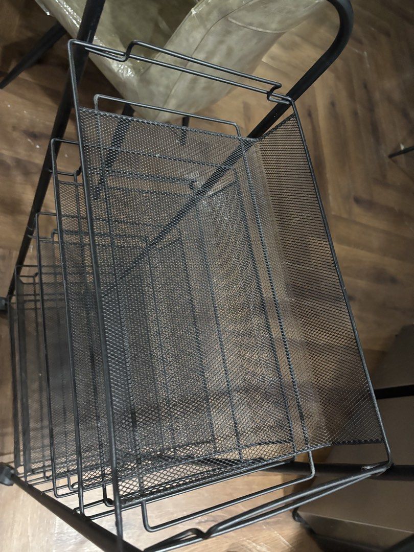 Black Metal Rolling Storage Cart (Category: Storage Boxes & Baskets) located in Mandaluyong City. Submitted by carol_0368 (Listing ID 1439489785, Image 3). Description: - Black metal storage cart - Features mesh shelves - Rolling design with wheels - Sturdy construction - Ideal for home or office - Tall and narrow for space-saving storage SIZE: Height: 41.5 inches Length:17 inches Width:10 inches.