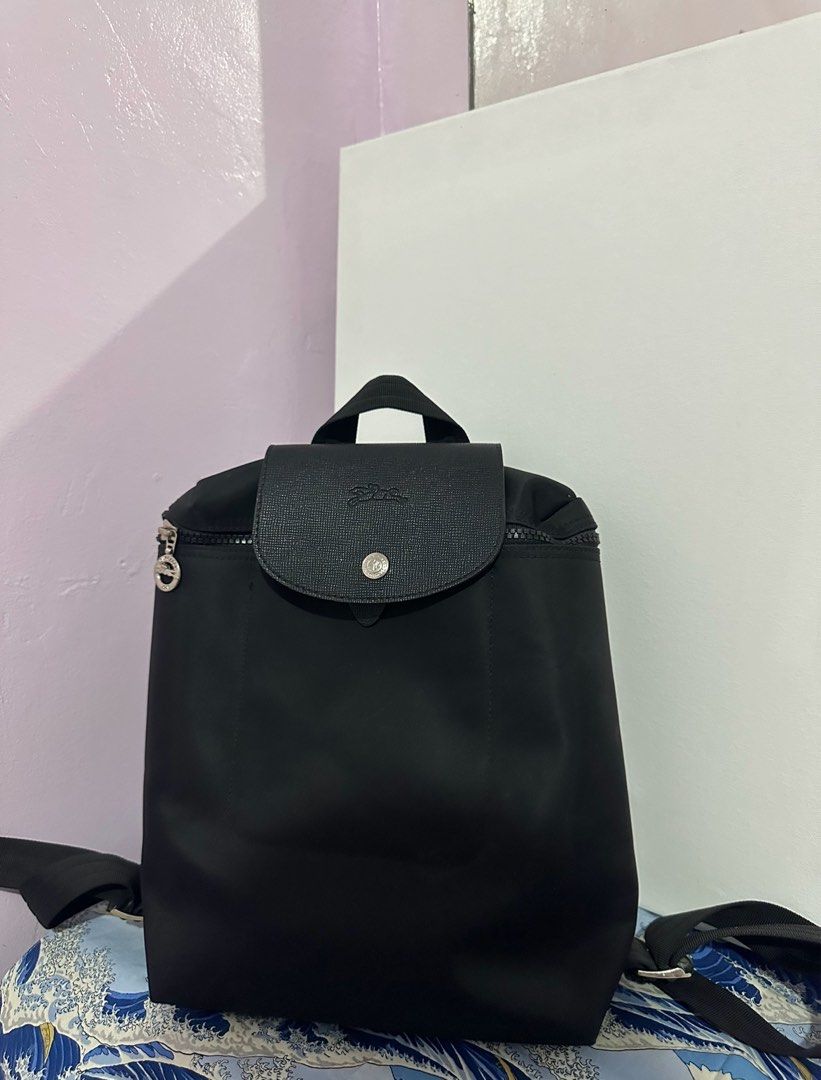 Black Quilted Wallet and Black Backpack (Category: Luxury Bags & Wallets) located in Antipolo. Submitted by ttrends (Listing ID 1439571344, Image 3). Description: Black wallet with a quilted design (from abroad. not used), including a black backpack (from orange app. like new) .