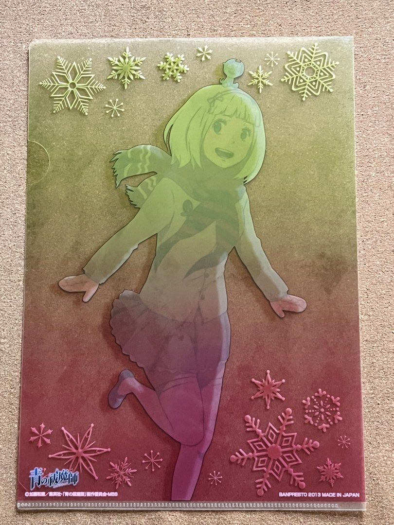 Blue Exorcist File Folder (Category: Stationery & School Supplies) located in Baguio. Submitted by gaara1234 (Listing ID 1439528839, Image 2). Description: - Anime-themed file folder - Features a female character with snowflakes - Clear plastic material - Gold-colored background - Character wearing a scarf and school uniform - Includes a small green frog - Contains Japanese text.