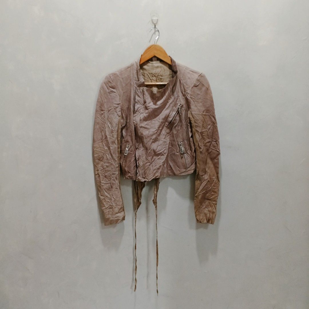 Blur Cropped Leather Jacket (Category: Coats, Jackets and Outerwear) located in Dagupan City. Submitted by youngthrift_ (Listing ID 1439514892, Image 1). Description: Size: 42 on tag width: 17.5 length: 19 Shoulder: 15 Sleeve: 25.5 Issue: None (Colors may vary due to lighting) Condition: 10/10 (Excellent) free shipping - Stylish cropped leather jacket - Asymmetrical design with zipper details - Features tie closures at the waist - Long sleeves - 
