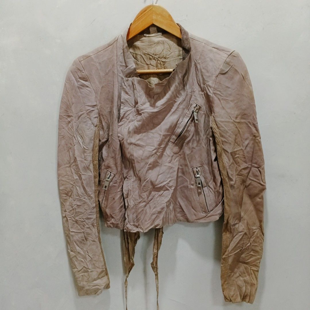 Blur Cropped Leather Jacket (Category: Coats, Jackets and Outerwear) located in Dagupan City. Submitted by youngthrift_ (Listing ID 1439514892, Image 2). Description: Size: 42 on tag width: 17.5 length: 19 Shoulder: 15 Sleeve: 25.5 Issue: None (Colors may vary due to lighting) Condition: 10/10 (Excellent) free shipping - Stylish cropped leather jacket - Asymmetrical design with zipper details - Features tie closures at the waist - Long sleeves - 
