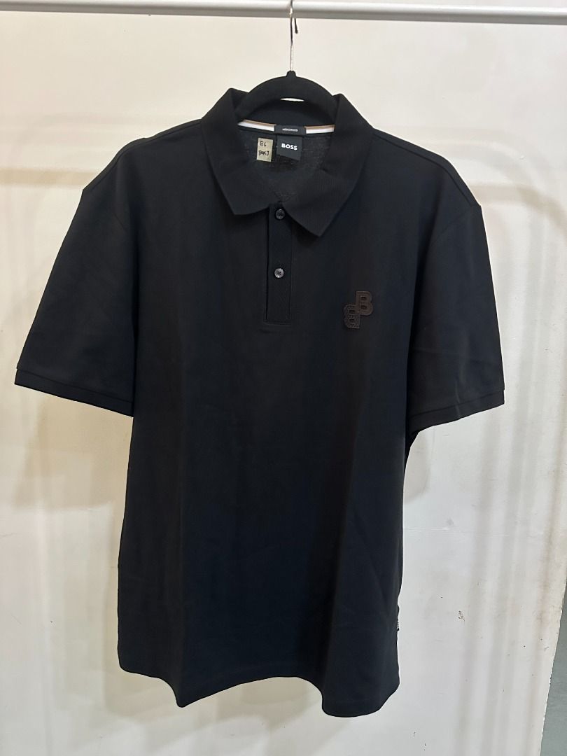 BOSS Black Polo Shirt (Category: Tshirts & Polo Shirts ) located in Batangas. Submitted by pink.dclttr (Listing ID 1439547768, Image 1). Description: - ORIGINAL Black BOSS polo shirt - Classic polo collar and short sleeves - BOSS logo on chest - Button-up placket - Comfortable fabric - Perfect for casual wear.