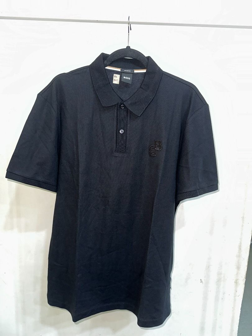 BOSS Black Polo Shirt (Category: Tshirts & Polo Shirts ) located in Batangas. Submitted by pink.dclttr (Listing ID 1439547768, Image 2). Description: - ORIGINAL Black BOSS polo shirt - Classic polo collar and short sleeves - BOSS logo on chest - Button-up placket - Comfortable fabric - Perfect for casual wear.