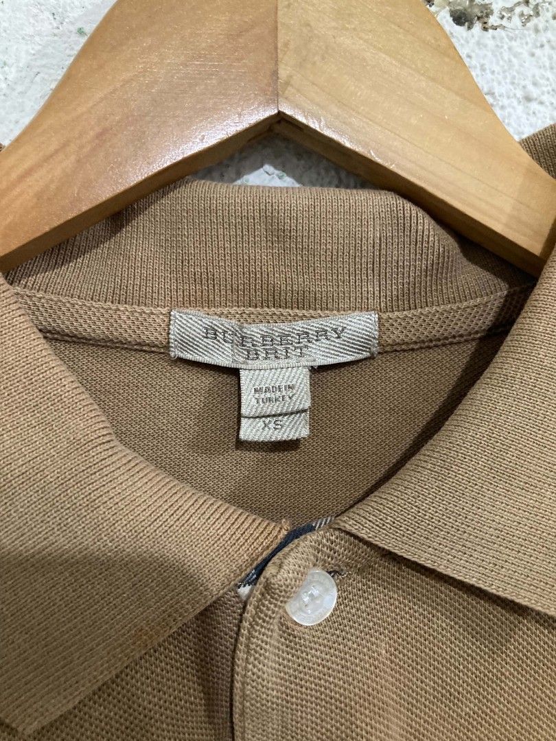 Burberry Brit Polo Shirt (Category: Shirts) located in San Jose del Monte. Submitted by zen31 (Listing ID 1439572646, Image 3). Description: BURBERRY POLO SHIRT XS ON TAG 19X29 DIMENSION VERY GOOD CONDITION 9/10 COLOR RATE ISSUE: STAINS ON FRONT.
