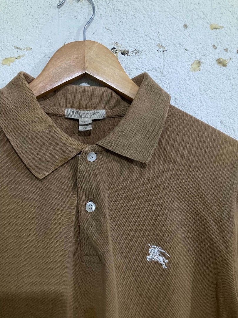 Burberry Brit Polo Shirt (Category: Shirts) located in San Jose del Monte. Submitted by zen31 (Listing ID 1439572646, Image 2). Description: BURBERRY POLO SHIRT XS ON TAG 19X29 DIMENSION VERY GOOD CONDITION 9/10 COLOR RATE ISSUE: STAINS ON FRONT.