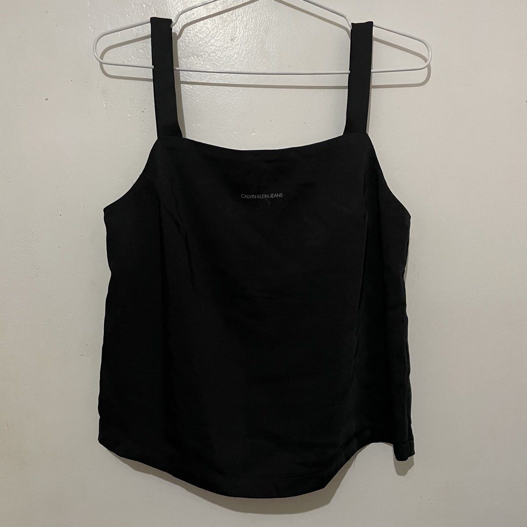 CALVIN KLEIN Jeans Black Tank Top (Category: Sleeveless) located in Leyte. Submitted by byebabies (Listing ID 1439557648, Image 1). Description: - Calvin Klein Jeans tank top - Square neckline - Thick straps - Calvin Klein Jeans logo on front - Size: S/P/CH - Made in Indonesia All items NEGOTIABLE for SAME DAY PAYMENT Do not offer 50% from its price Everything priced below 500 can be sold as bulk for 4items for 1k only Everything priced from 600-