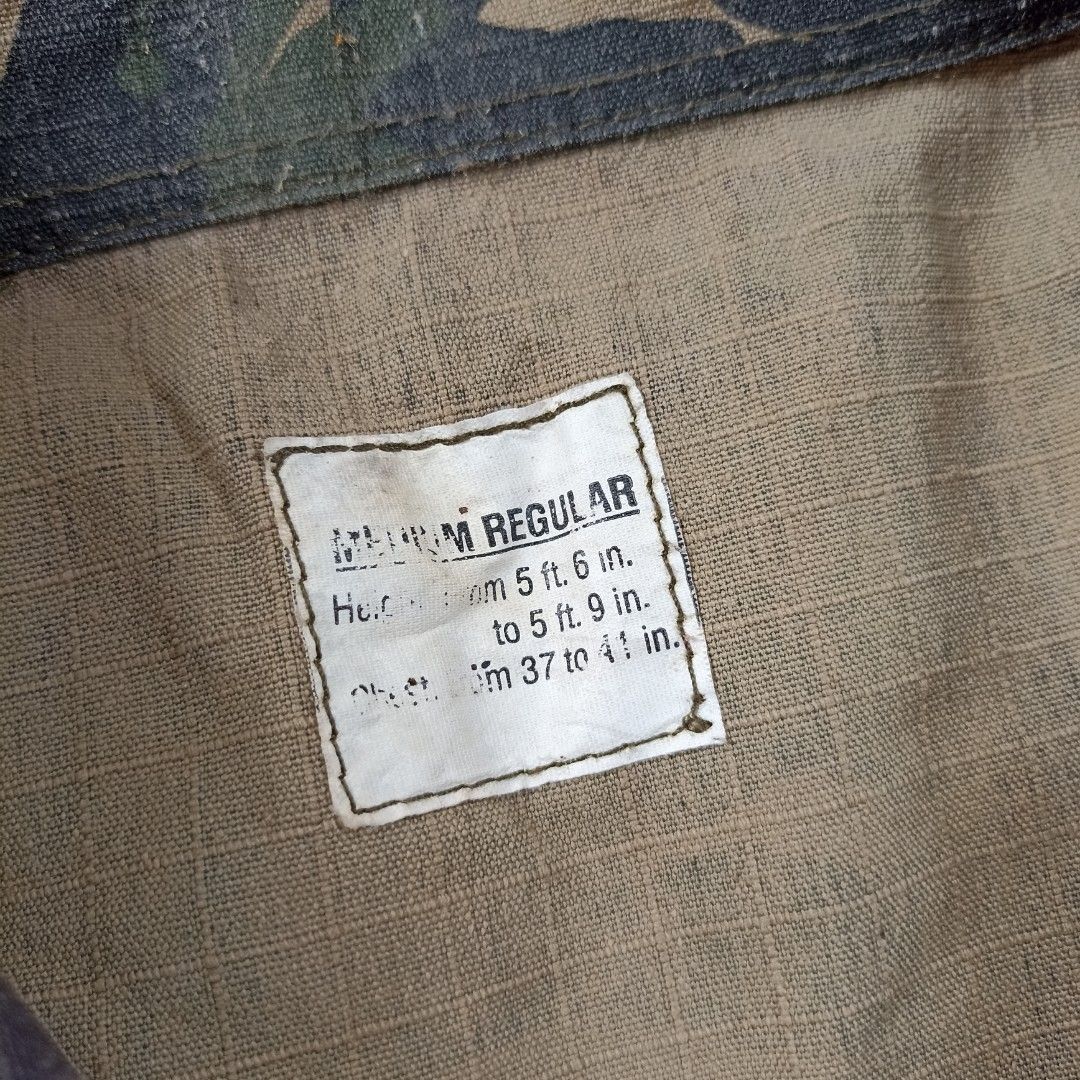 Camouflage Jacket (Category: Coats, Jackets and Outerwear) located in Davao. Submitted by anythin6 (Listing ID 1439535719, Image 2). Description: - Authentic Philippine Army camouflage jacket - Size: Medium Regular - Fits heights: 5'6" to 5'9" - Chest size: 37" to 41" - Features: Button-up front, four front pockets, collared neckline - Camouflage pattern: Green and brown.
