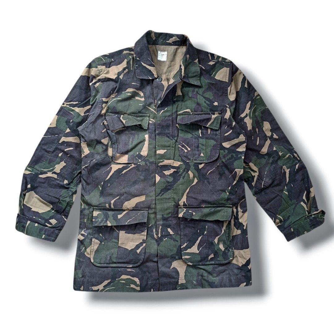 Camouflage Jacket (Category: Coats, Jackets and Outerwear) located in Davao. Submitted by anythin6 (Listing ID 1439535719, Image 1). Description: - Authentic Philippine Army camouflage jacket - Size: Medium Regular - Fits heights: 5'6" to 5'9" - Chest size: 37" to 41" - Features: Button-up front, four front pockets, collared neckline - Camouflage pattern: Green and brown.