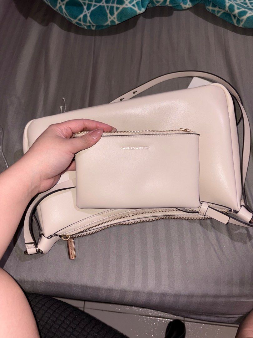 Charles & Keith — Calla Oat (M) (Category: Shoulder Bags) located in Pasay City. Submitted by ydeclutters (Listing ID 1439583415, Image 3). Description: with a very minimal stain sa bottom ng bag (see pics) with paperbag, dustbag and receipt pa has the extender para maging cross body bag bought nung dec 2025 RFS: not using na - used 4-5x only .