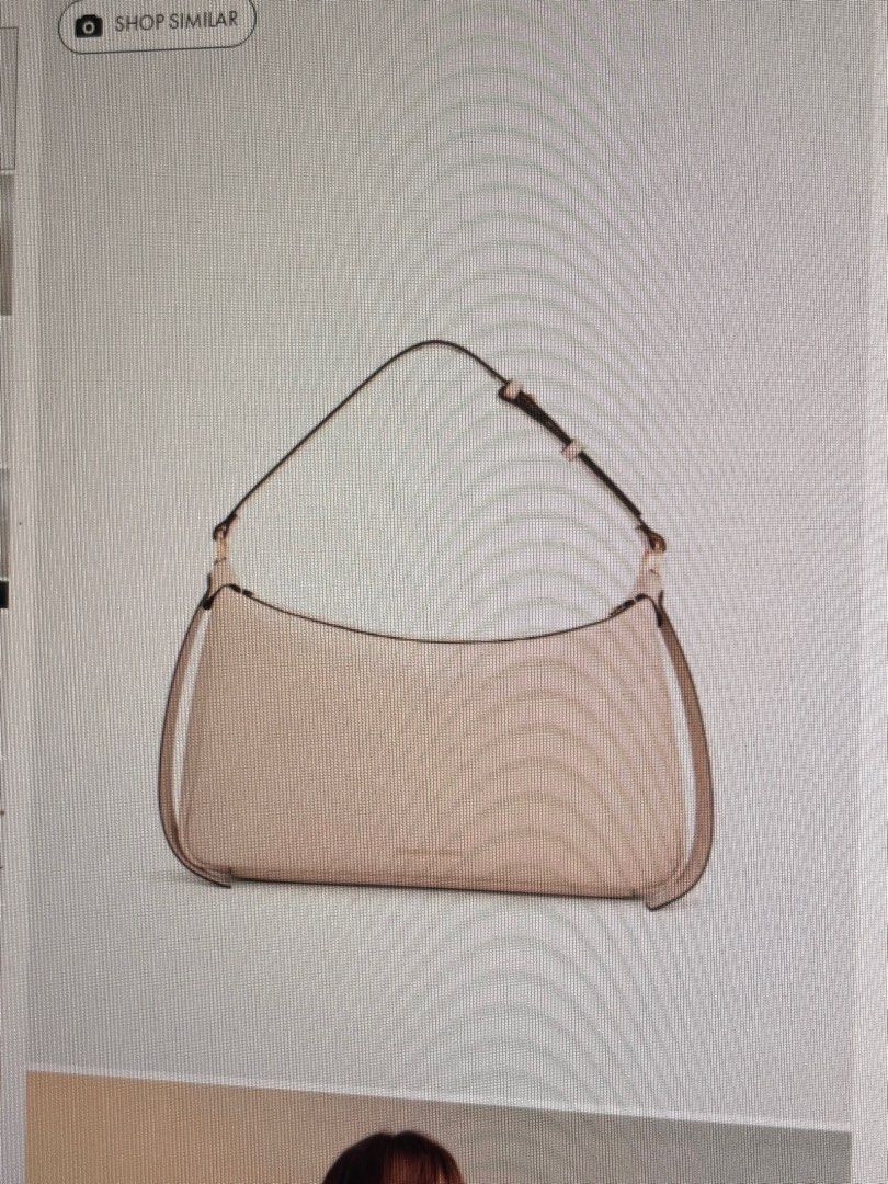 Charles & Keith — Calla Oat (M) (Category: Shoulder Bags) located in Pasay City. Submitted by ydeclutters (Listing ID 1439583415, Image 1). Description: with a very minimal stain sa bottom ng bag (see pics) with paperbag, dustbag and receipt pa has the extender para maging cross body bag bought nung dec 2025 RFS: not using na - used 4-5x only .