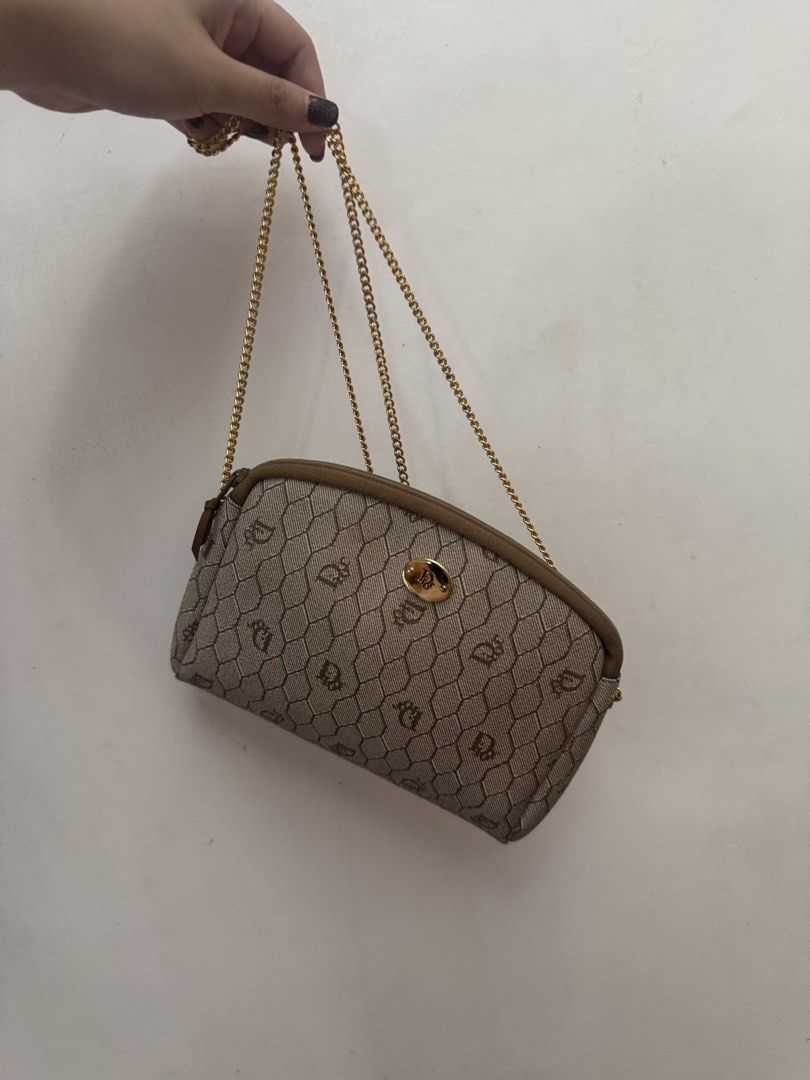 Christian Dior Shoulder Bag with Chain (Category: Luxury Bags & Wallets) located in Malolos. Submitted by ebc17 (Listing ID 1439450816, Image 1). Description: - Authentic Christian Dior shoulder bag - Beige monogram pattern - Elegant gold chain strap - Secure zip closure with gold-tone clasp - Compact and stylish design - Dior logo detail - Ideal for carrying essentials.