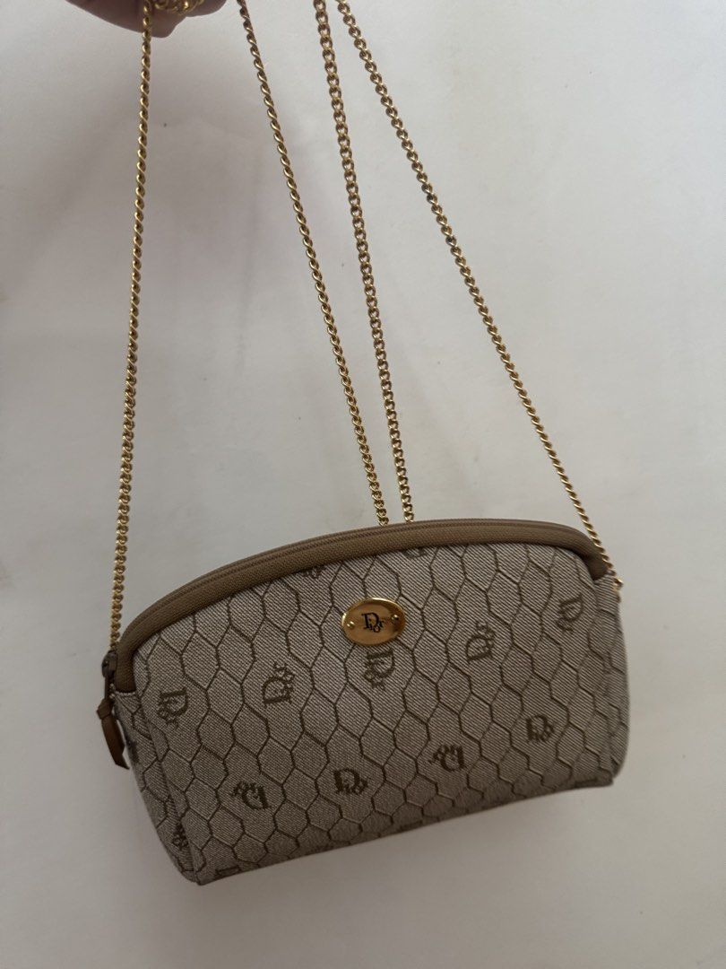 Christian Dior Shoulder Bag with Chain (Category: Luxury Bags & Wallets) located in Malolos. Submitted by ebc17 (Listing ID 1439450816, Image 2). Description: - Authentic Christian Dior shoulder bag - Beige monogram pattern - Elegant gold chain strap - Secure zip closure with gold-tone clasp - Compact and stylish design - Dior logo detail - Ideal for carrying essentials.