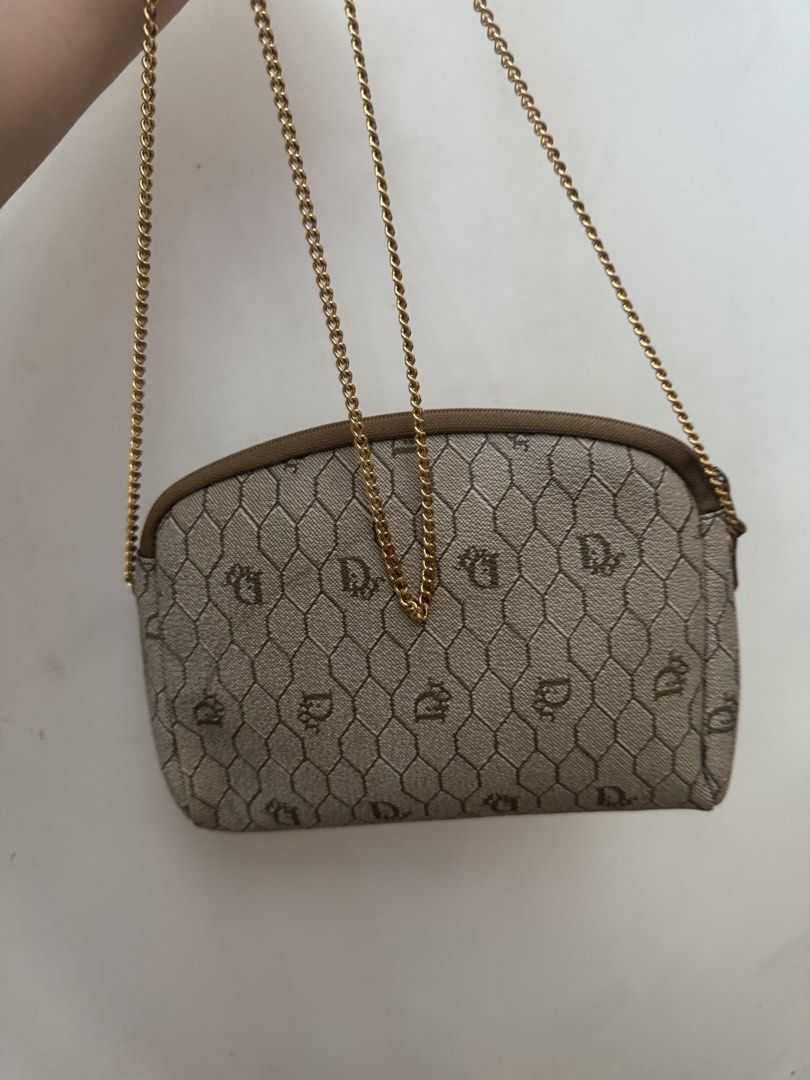 Christian Dior Shoulder Bag with Chain (Category: Luxury Bags & Wallets) located in Malolos. Submitted by ebc17 (Listing ID 1439450816, Image 3). Description: - Authentic Christian Dior shoulder bag - Beige monogram pattern - Elegant gold chain strap - Secure zip closure with gold-tone clasp - Compact and stylish design - Dior logo detail - Ideal for carrying essentials.