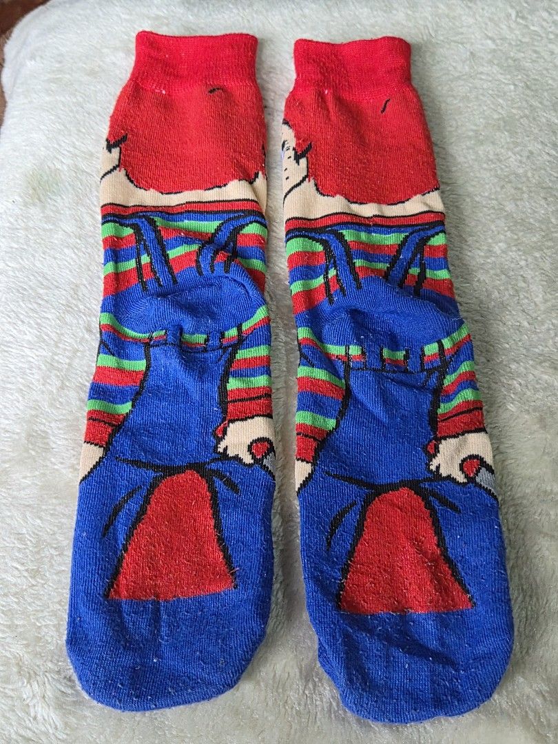 Chucky Socks (Category: Socks) located in Mandaue City. Submitted by chuchi152615 (Listing ID 1439513531, Image 3). Description: - Chucky-themed socks - Features iconic Chucky doll design - Colors: Red, blue, green, and white - Long socks - Includes Chucky's face and overalls design - Red cuff.
