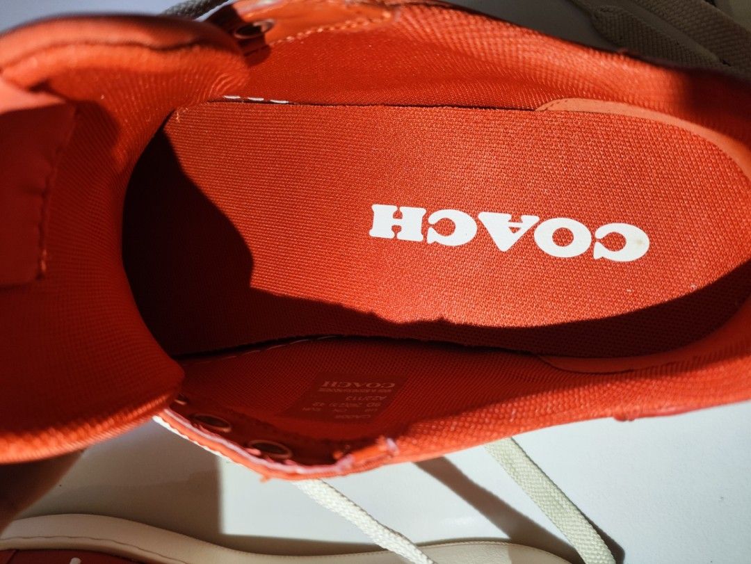 Coach Red Sneakers (Category: Casual Shoes) located in Taguig. Submitted by declutterwithsev (Listing ID 1439594278, Image 3). Description: Authentic Coach Low-Top Sneakers (Burnt Orange / Red) Selling a pair of authentic Coach low-top sneakers in a striking burnt orange/red colorway with clean cream soles. Super stylish, lightweight, and perfect for casual wear. Size & Details: Model Code: CA006 US Size: 9D (Men's) EUR Size: 42 CN Size: 260 (2.5
