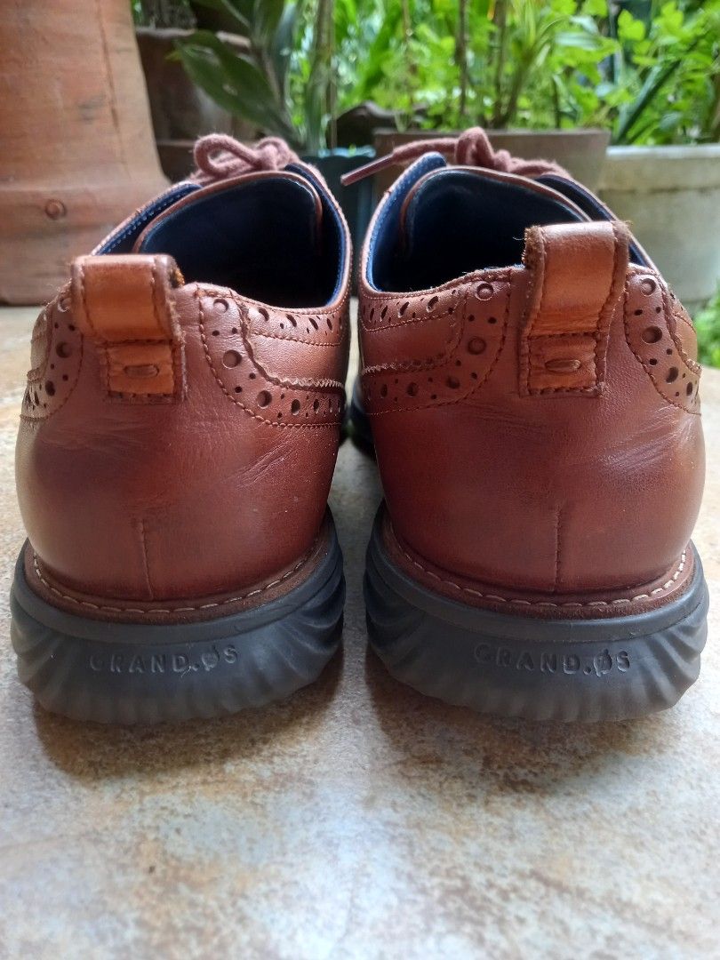 Cole Haan Grandevolution Wingtip Oxford Shoes (Category: Dress Shoes) located in Davao. Submitted by kirk214red-50020 (Listing ID 1439491382, Image 3). Description: - Cole Haan Grandevolution wingtip oxfords - Brown leather - Classic wingtip design with perforations - Size: 9M - Dark sole - Blue interior lining with Cole Haan branding - Lace-up closure - Made in Vietnam.