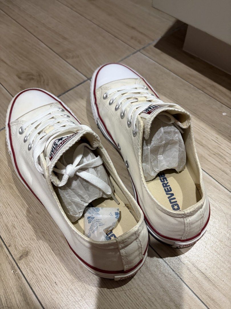 Converse All Star Low Top (Category: Sneakers) located in Mandaluyong City. Submitted by getbounced (Listing ID 1439519520, Image 2). Description: Classic Converse All Star low top sneakers in white. Features the iconic Converse All Star logo on the tongue and heel. The shoes have white laces and a red stripe on the sole. The size is US Men's 7.5, EUR 41, and 260 (2.5)..