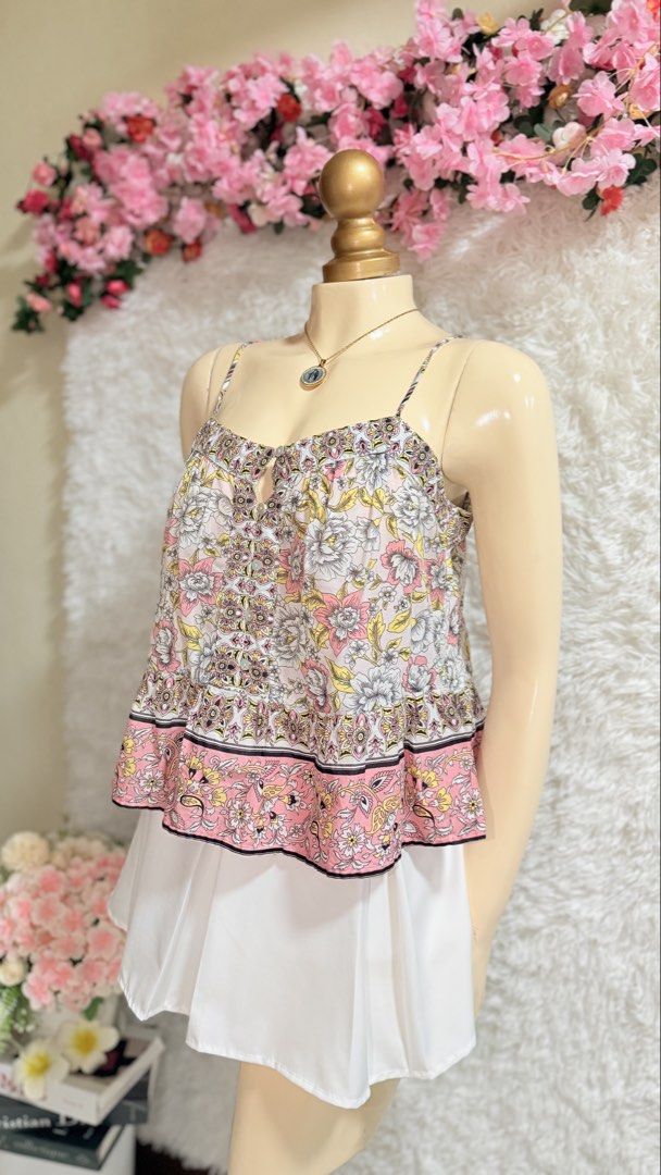 Cotton On Floral Cami Top (Category: Sleeveless) located in Manila. Submitted by wandf.tala (Listing ID 1439475924, Image 2). Description: - Cotton On cami top - Floral print - Adjustable spaghetti straps - Peplum hem - Button-down front - Color: Pink and white - Size: S/P - Made in India.