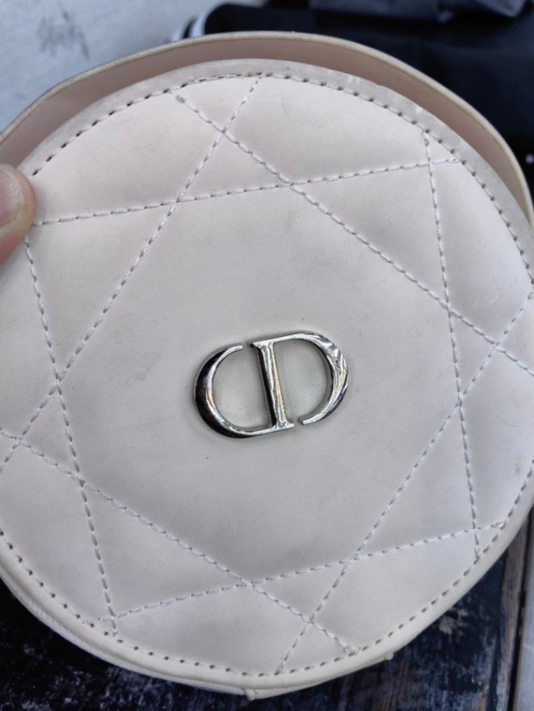 Dior Round Crossbody Bag (Category: Luxury Bags & Wallets) located in Quezon City. Submitted by flat.earther23 (Listing ID 1439489899, Image 2). Description: - Cream-colored, quilted crossbody bag - Features a silver-tone CD logo - Gold chain strap with white leather accents - Dior branded zipper pull - Cream-colored, clean interior.