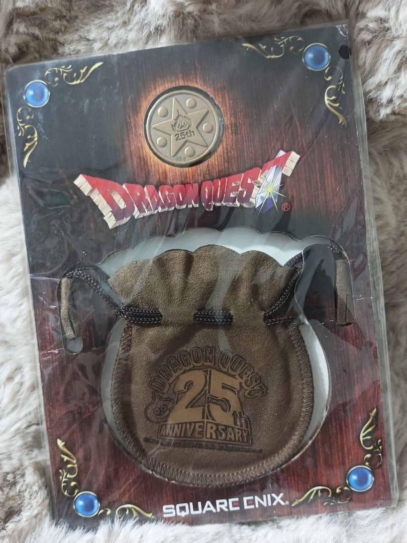 Dragon Quest 25th Anniversary Coin Pouch (Category: Character Goods) located in Manila. Submitted by laydeemoonrcl (Listing ID 1439582650, Image 2). Description: - Dragon Quest 25th Anniversary coin pouch. - Features the Dragon Quest logo and 25th Anniversary emblem. - Color: Brown - Closure: Drawstring - Includes a coin. - Comes with original packaging. - Official Square Enix merchandise..