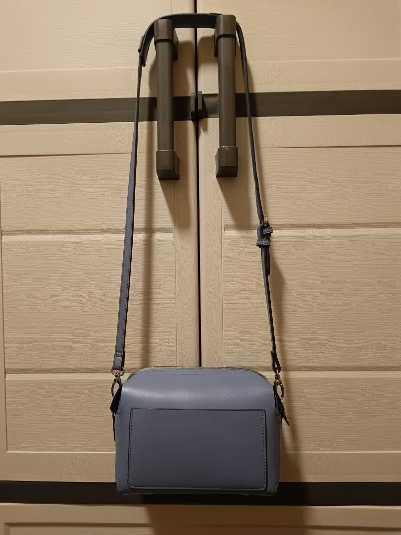 ELLE Blue Crossbody Bag with Silver Hardware (Category: Cross-body Bags) located in Quezon City. Submitted by dhl.chx (Listing ID 1439531113, Image 1). Description: - Light blue crossbody bag - Sleek rectangular design - Front pocket for easy access - Secure top zipper closure - Elegant silver-colored hardware - Protective metal feet on the bottom - Adjustable strap for a comfortable fit.
