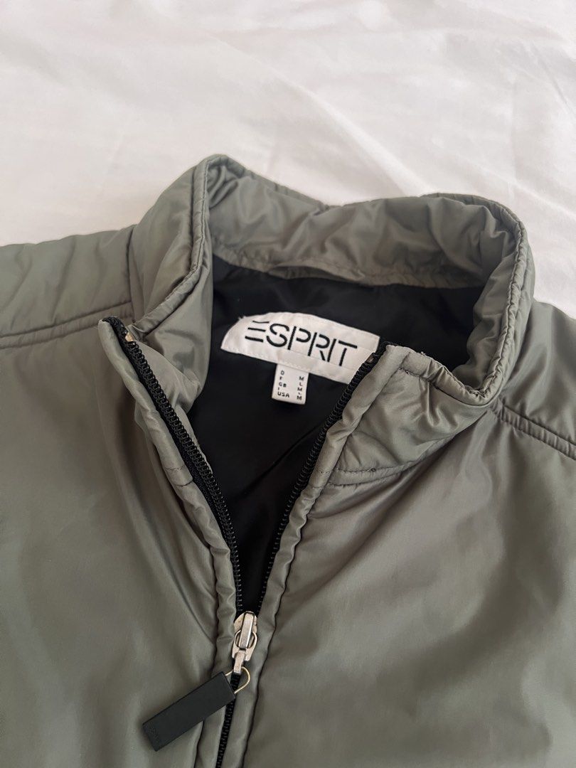 Esprit Nylon Padded Vest (Category: Others Tops) located in Caloocan City. Submitted by _miumuse (Listing ID 1439488740, Image 2). Description: - Olive green Esprit vest - Size: M on tag - Full zip closure - Stand-up collar - Two front pockets - Quilted design.
