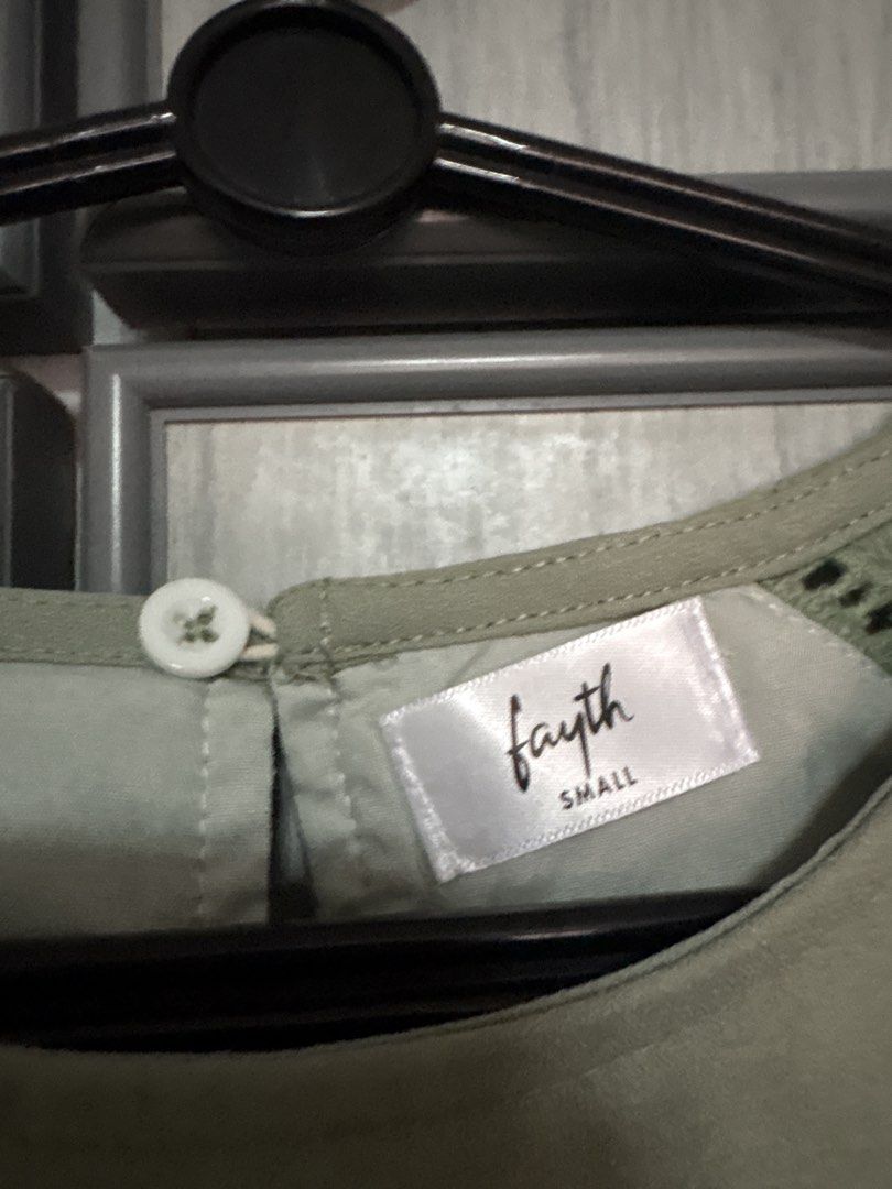 Fayth Top (Category: Blouses) located in Singapore. Submitted by cheapdealsherex (Listing ID 1439512809, Image 2). Description: - Round neckline - Short sleeves - Unique stitch detail on shoulders - Versatile for dressing up or down.