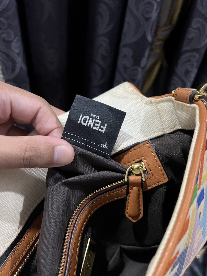 Fendi Multicolored Baguette (Category: Luxury Bags & Wallets) located in Quezon City. Submitted by just.loveclub (Listing ID 1439546085, Image 3). Description: Fendi Baguette Multicolor Canvas Bag with an embroidered FF pattern. With minimal signs of wear.