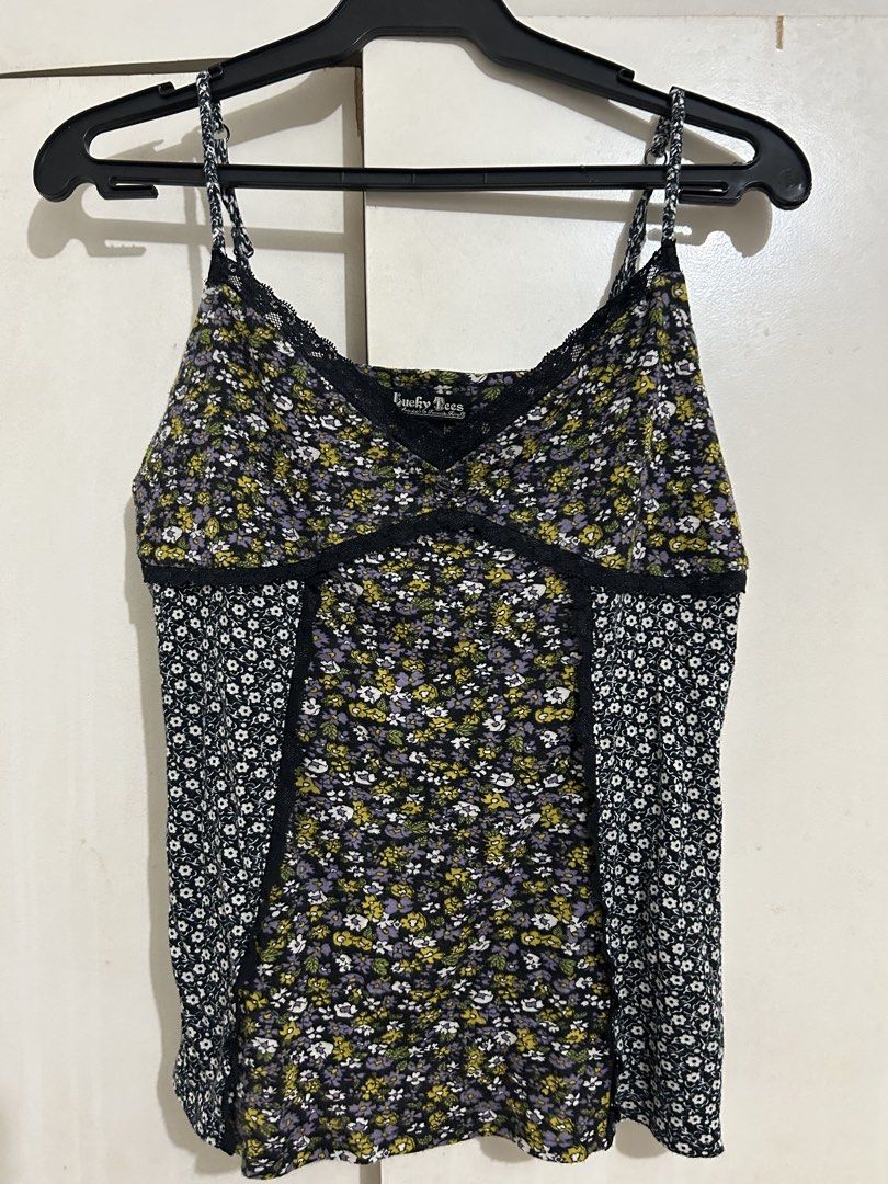 Floral Camisole (Category: Sleeveless) located in Quezon City. Submitted by samthingsshop (Listing ID 1439564474, Image 1). Description: - Floral print camisole - Black lace trim - Adjustable spaghetti straps - V-neckline - Mixed floral patterns - Lightweight material - Suitable for layering.