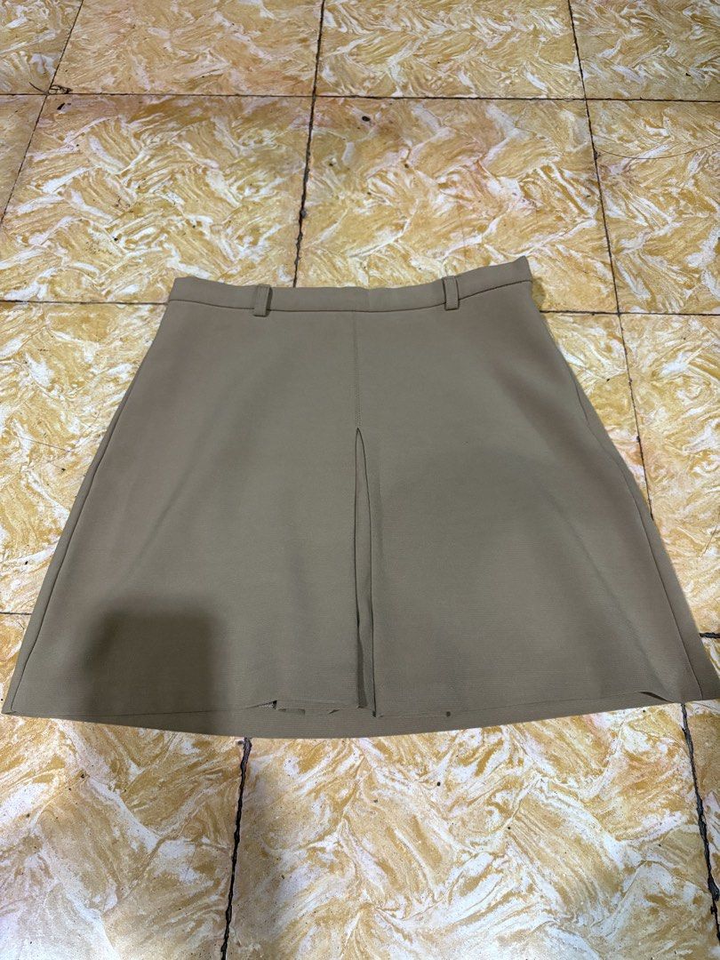 Forever 21 Beige Skirt - Size S (Category: Skirts) located in Makati City. Submitted by goodfindsonly (Listing ID 1439527724, Image 1). Description: - Forever 21 beige skirt - Size: S - Features a front slit - Made in China - Classic design - Versatile for various occasions - Easy to pair with different tops and shoes.