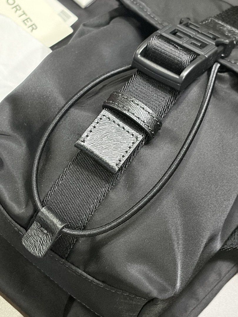 Givenchy Mini 4G Light Backpack (black) (Category: Luxury Bags & Wallets) located in Quezon City. Submitted by sellinah (Listing ID 1439529902, Image 3). Description: Givenchy crossbody bag in black nylon. Features a front buckle closure with the Givenchy logo. Includes a branded dust bag, tags, and a Mr. Porter tag. The bag has a shoulder strap with Givenchy branding..