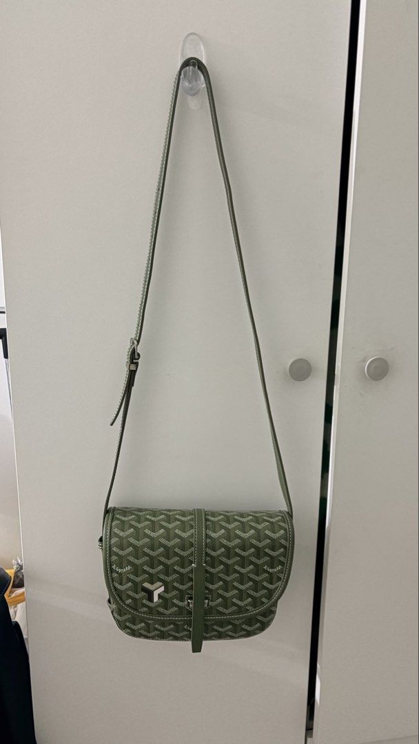 Goyard Saint Sulpice Messenger Bag (Category: Luxury Bags & Wallets) located in Manila. Submitted by rarewhale_9a584c (Listing ID 1439553752, Image 1). Description: - Goyard Saint Sulpice Messenger Bag - Color: Green - Signature Goyardine canvas with white stitching - Silver-tone buckle closure - Interior lined with orange fabric - Adjustable shoulder strap -the strap needs repair.