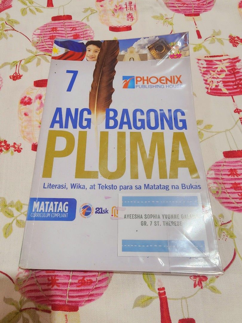 Grade 7 Textbook Bundle (Category: Textbooks) located in Mandaluyong City. Submitted by my_closet11 (Listing ID 1439503559, Image 2). Description: Bundle of Grade 7 textbooks. Includes "Science in Today's World", "Technology and Livelihood Education", "Falling in Love with God", "ECAS English Communication Arts and Skills", "Realistic Math", "Physical Education and Health", and "Ang Bagong Pluma". All books appear to be from Phoenix Publishing Ho